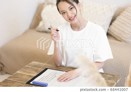 Young woman doing sutras at home Young woman doing sutras at home 68441007