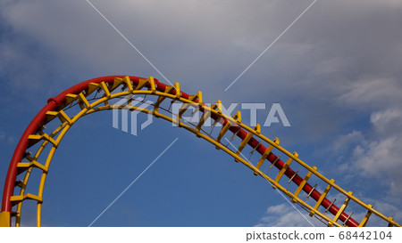 Roller Coaster Ride in Amusement Park. Entertainment and Adventure Roller Coaster Ride in Amusement Park. Entertainment and Adventure 68442104