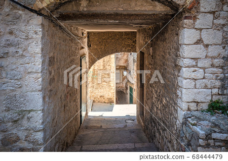 Street with a historic architecture in Sibenik. Street with a historic architecture in Sibenik. 68444479