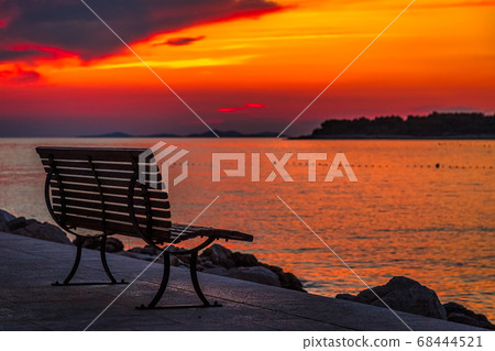 Sea landscape at sunset with bench in Primosten Sea landscape at sunset with bench in Primosten 68444521