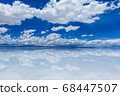 Blue sky and white clouds Uyuni salt lake mirrored 68447507
