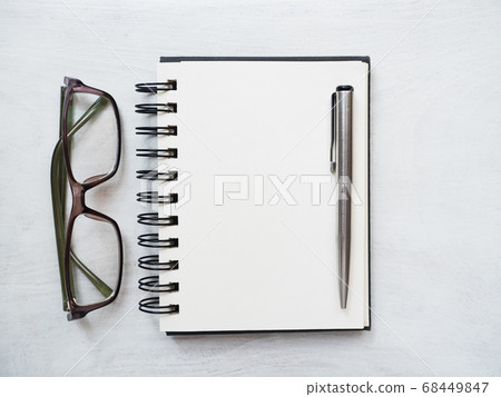 Blank notepad page, pen and glasses. Greeting card Blank notepad page, pen and glasses. Greeting card 68449847