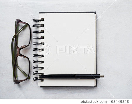Blank notepad page, pen and glasses. Greeting card Blank notepad page, pen and glasses. Greeting card 68449848