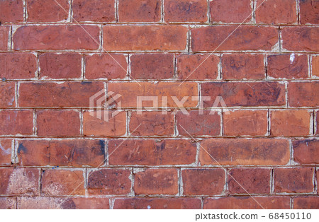 The wall of the building is made of old white brick. Background for text, posters. The brick is destroyed, the brick crumbles. Lots of bricks in the background. The wall of the building is made of old white brick. Background for text, posters. The brick is destroyed, the brick crumbles. Lots of bricks in the background. 68450110
