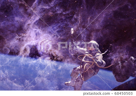 Astronaut. Nebula, cluster of stars. Elements of this image furnished by NASA. Astronaut. Nebula, cluster of stars. Elements of this image furnished by NASA. 68450503