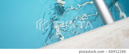 Pool ladder and water ripples Pool ladder and water ripples 68452266