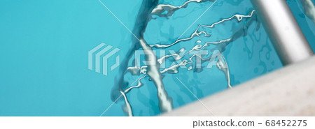 Pool ladder and water ripples Pool ladder and water ripples 68452275