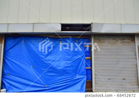 Buildings and houses damaged by strong winds 68452672