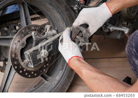 The process of replacing brake pads on a The process of replacing brake pads on a 68453203