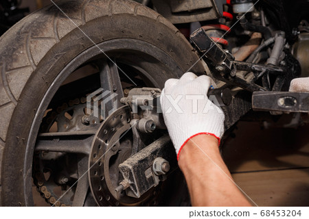 The process of replacing brake pads on a The process of replacing brake pads on a 68453204