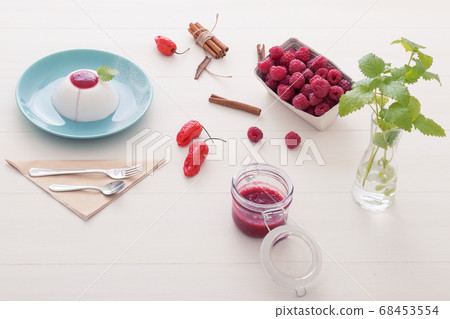 Panna Cotta, traditional sweet Italian dessert with raspberry puree and touch of Bhut jolokia chilli Panna Cotta, traditional sweet Italian dessert with raspberry puree and touch of Bhut jolokia chilli 68453554
