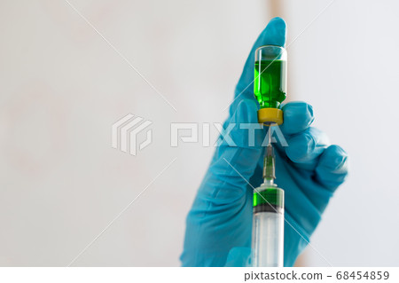 Doctors or scientists prepare a vaccine to prevent a new strain of influenza to inject the patient to create immunity in the body, Vaccinate concept. 68454859