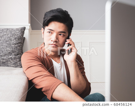 Young man wearing casual clothes and talking on Young man wearing casual clothes and talking on 68456124