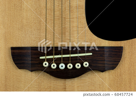 Acoustic Guitar Bridge Close Up 68457724