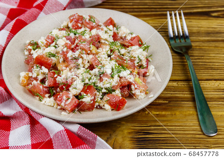 Tasty salad of tomato, cottage cheese, dill  68457778