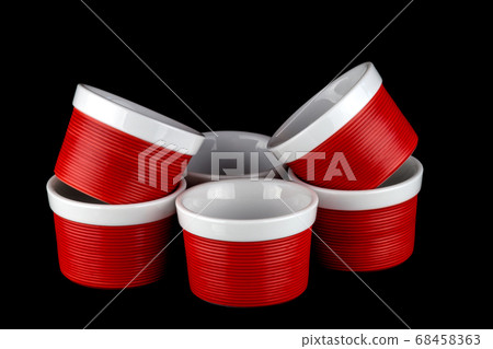 Red and White Ramekins Isolated on Black 68458363