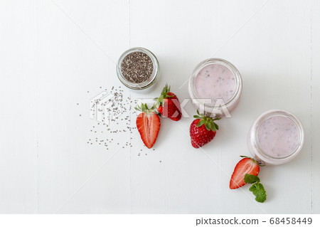 Strawberry smoothie, healthy organic drink withchia seeds and milk. Strawberry smoothie, healthy organic drink withchia seeds and milk. 68458449