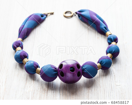 necklace of round silk beads and purtple ball 68458817