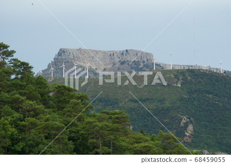 TARRAGONA, SPAIN - AUG 29th, 2017: A wind farm, group of Small wind turbine in the same location used to produce electricity in Catalonia 68459055