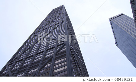 CHICAGO, ILLINOIS, UNITED STATES - DEC 11th, 2015: The South Facade of the John Hancock Building in Chicago CHICAGO, ILLINOIS, UNITED STATES - DEC 11th, 2015: The South Facade of the John Hancock Building in Chicago 68459121
