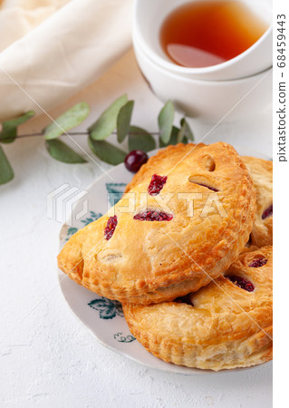 puff buns with raspberries on a vintage plate on a 68459443