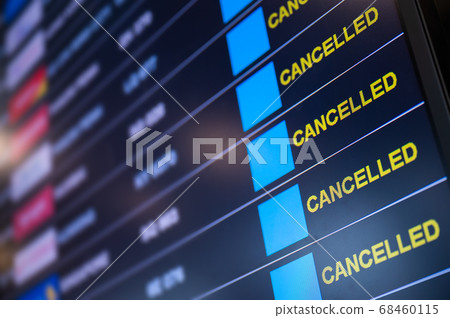 Flights cancelled on information time table board in airport  68460115