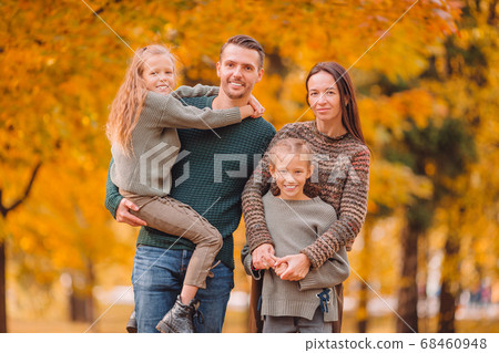 Portrait of happy family of four in autumn Portrait of happy family of four in autumn 68460948