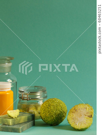 Green Osage Apple fruits, Soaps and lotions made from this unique plant. Vertical frame with space 68463251