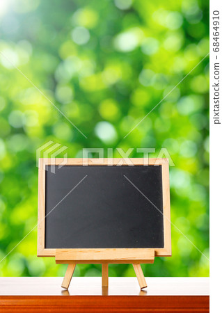 Blackboard and green background 68464910