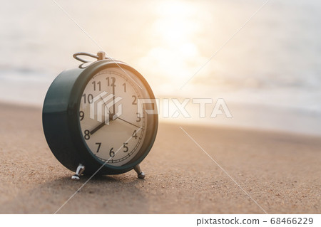 Selective focus of alarm clock with nature 68466229