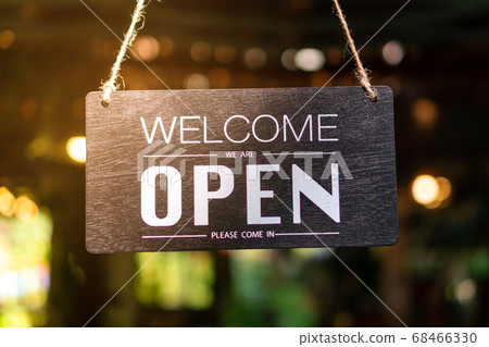 A business sign that says open on cafe or 68466330