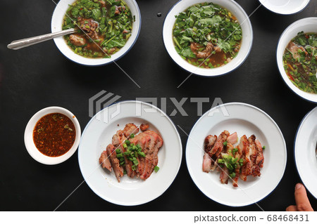grilled pork , pork steak and spicy soup 68468431