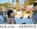 Autumn Japanese garden and women 68469018