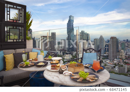 Table of chinese food on the table in roof top bar Table of chinese food on the table in roof top bar 68471145