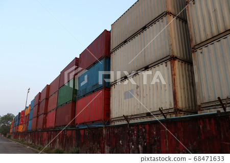 Shipping Containers placed as layered in the storage facility. 68471633