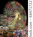 A big Ferris wheel shining at night 68471722