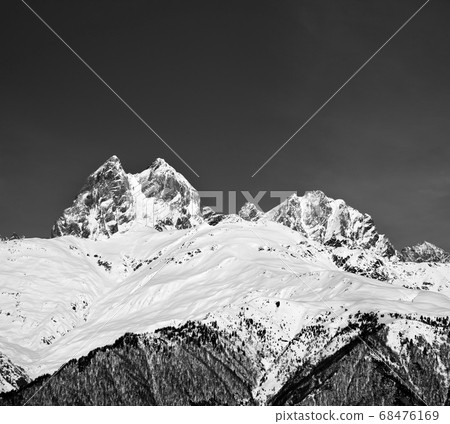High snowy mountains in winter at sun day High snowy mountains in winter at sun day 68476169