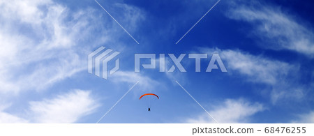 Silhouette of skydiver at sky 68476255