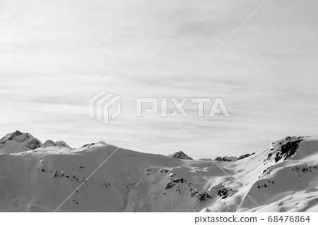 Snowy slopes in high winter mountains and sunlit Snowy slopes in high winter mountains and sunlit 68476864