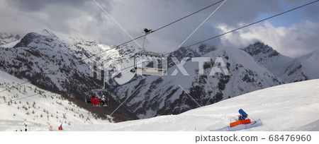 Chair-lift, snowy ski track prepared by snowcat, Chair-lift, snowy ski track prepared by snowcat, 68476960