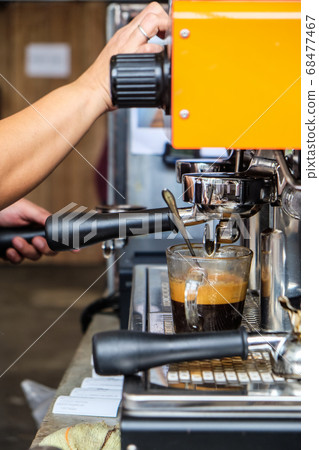 Coffee pouring machine close up in modern cafe 68477467