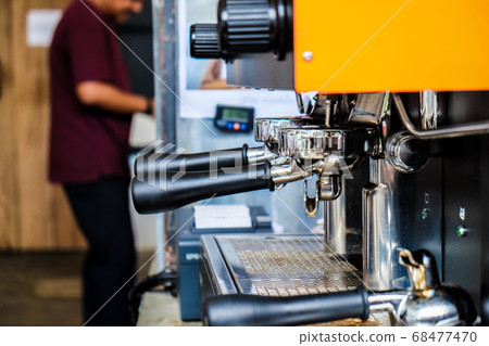 Coffee pouring machine close up in modern cafe 68477470