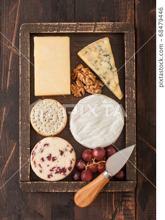 Selection of various cheese in wooden box Selection of various cheese in wooden box 68479446