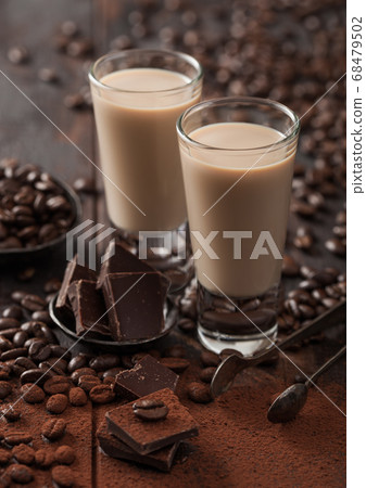 Shot glasses of Irish cream baileys liqueur Shot glasses of Irish cream baileys liqueur 68479502