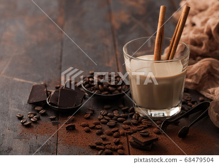Glass of Irish cream baileys liqueur with cinnamon 68479504