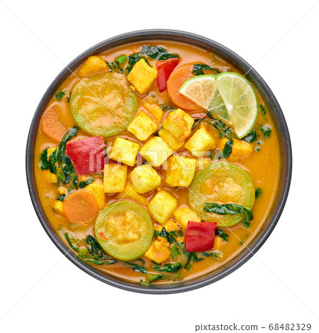 A Yellow Veg Thai Curry with Tofu and vegetables isolated on white 68482329