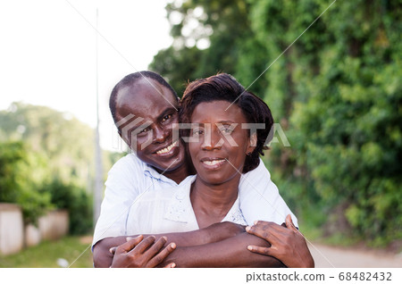 happy young couple embracing in countryside. 68482432