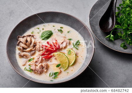 Tom Kha Gai or Thai Coconut Chicken Soup in matte gray bowl Tom Kha Gai or Thai Coconut Chicken Soup in matte gray bowl 68482742