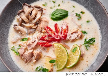 Tom Kha Gai or Thai Coconut Chicken Soup in matte gray bowl Tom Kha Gai or Thai Coconut Chicken Soup in matte gray bowl 68482743