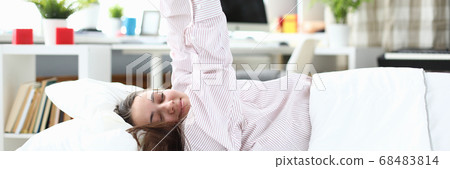 Charming young woman dreaming 68483814